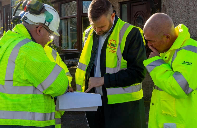 Andrew Stephenson MP being shown plans of the improvements