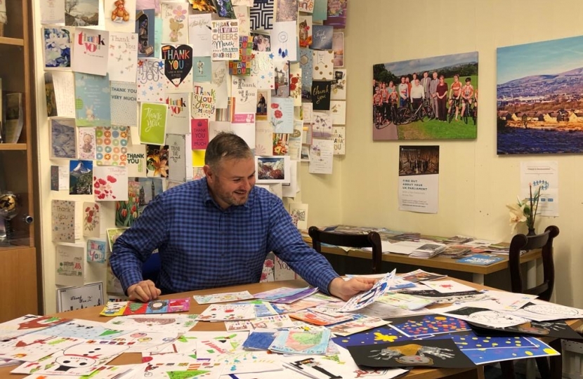 Andrew selecting the winning entry from hundreds of entries 